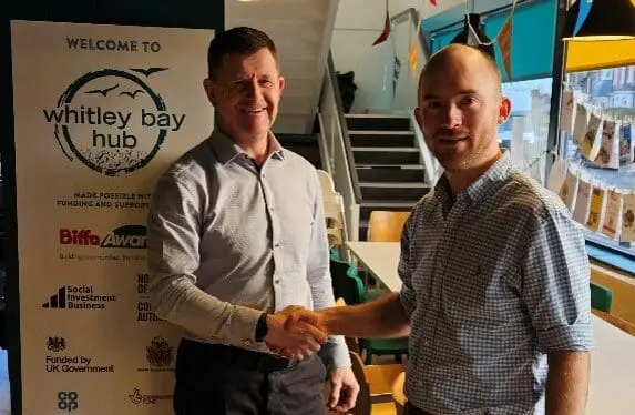Lee Thomson and David Carnaffen shaking hands