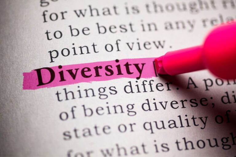 Page in a book with text, the word 'diversity' is being highlighted in pink.