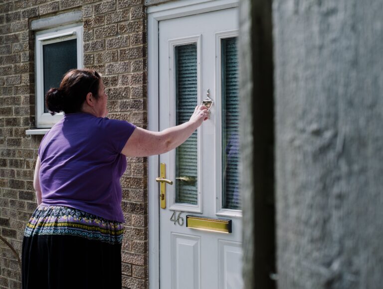 Woman knocking at door