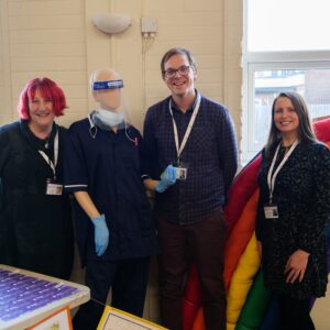 VODA Staff with mannequin and rainbow
