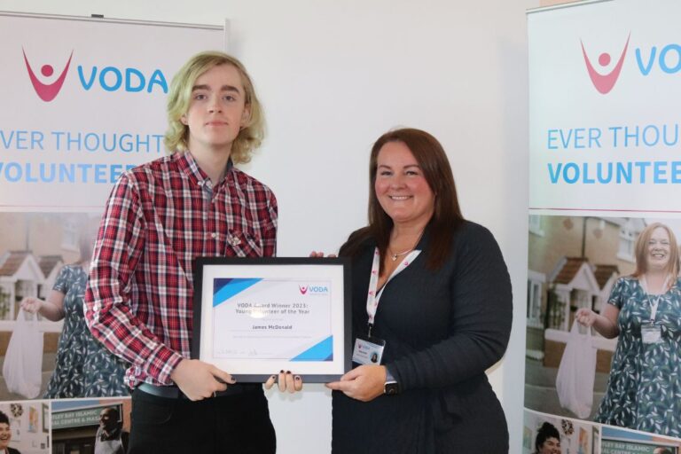 James McDonald receiving award from VODA's Vicky Smith