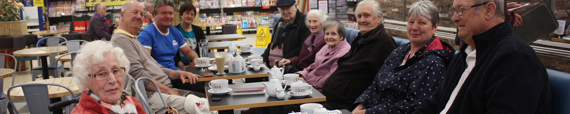 A group of Good Neighbours having a cuppa in a cafe