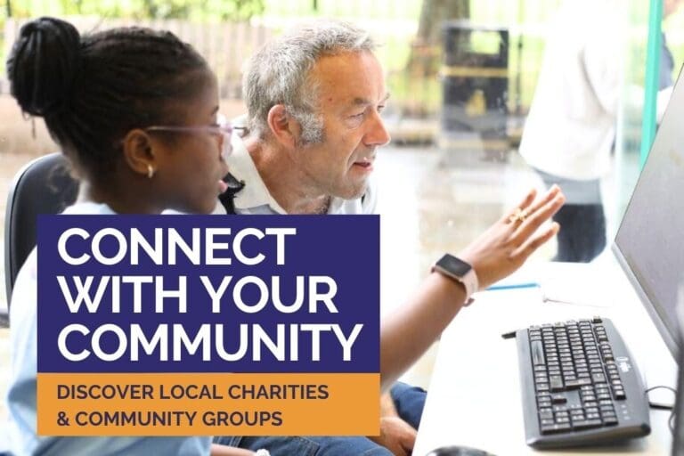 Young woman and older man sat at a computer. She is giving him an overview of how to get online. Text says connect with your community. Discover charities and community groups.