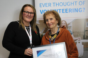 Trustee of the Year Carol Dennison accepting her award from VODA CEO