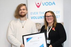VODA Volunteer of the Year Alec Clavering accepting his award from Vicky Smith