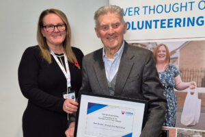 Volunteer Commendation - Alan Brown accepting his certificate from Vicky Smith
