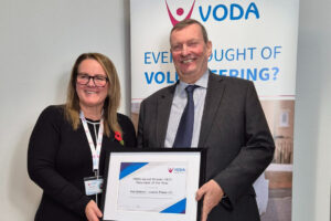 Volunteer of the Year Ken Dobson accepting his award from Vicky Smith