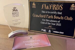 A certificate, glass award and ticket for Crawford Park for winning Bowls England