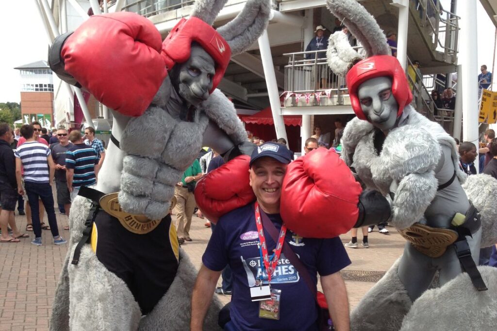 Ray with giant rabbit mascotts wearing boxing gear