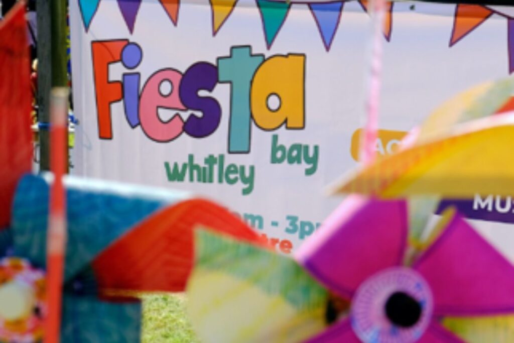 Colourful banners and bunting with the words 'Fiesta Whitley Bay'